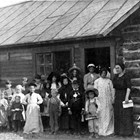 The first school in Knik, 1913.  Five of the children pictured here were Bartholf children - Marjorie, Pearl, Chester, Ralph and Edith.  May Cody was the teacher.