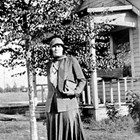 Eleanor Marsch in front of the family home, 7th Avenue and H Street, Anchorage, 1936.