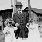 John Casey McDannel with the twins (Helen and Mary) at 4th Avenue and K Street, Anchorage, 1919.