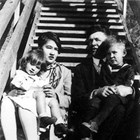 Renee and Harry Seller with younger children Betty and John on the steps of their home in Anchorage at the end of Fourth Avenue, 1927.