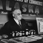 Z. J. Loussac promoting Alaska at a booth at the Seattle Sports and Vacation Show, ca. 1950.