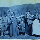 Martha White among the “Notables of the Sunrise Hotel” in 1898.  Photograph taken during Captain Edwin F. Glenn’s expedition to Cook Inlet looking for a route into the interior gold fields. Martha White is the third person on the left; next to her is her young daughter, Martha "Babe" White. 