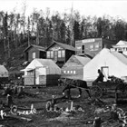 In 1915, Martha “Mother” White moved to the mouth of Ship Creek in expectation of the construction of the Alaska Railroad.  With her she brought two large tents; one functioned as a bunkhouse, the other as a café.  