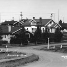 A view of Christensen Road, which curves uphill from the railroad yards at Ship Creek to what is now downtown Anchorage, where all the streets are straight and meet at right angles.  Many of the Alaska Railroad executives, such as Colonel Frederick Mears, lived in government built houses along the road, in an area known as “Snob Hollow.”