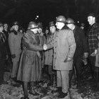 The military need for a closer ice-free port to Anchorage led to the boring of the Whittier Cut-off tunnels and the development of Whittier as a port.  Tunneling was done from both sides, and the final blast connecting the two tunnels occurred on November 20, 1942.  Here Otto Ohlson (left) shakes hands with General Simon Bolivar Buckner, Jr., commander of U.S. troops in Alaska, at the connection point. 